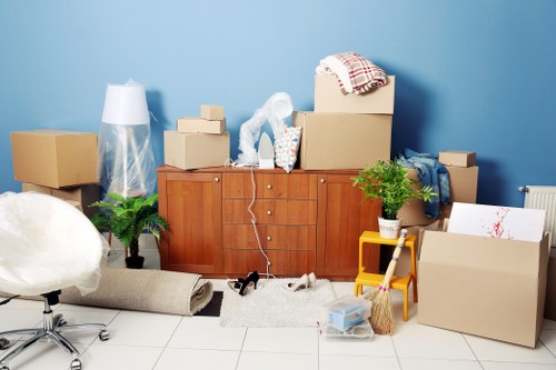 Careful wrapping of fragile household items during a Westminster packing service