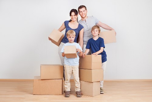Worker assessing moving risks before lifting